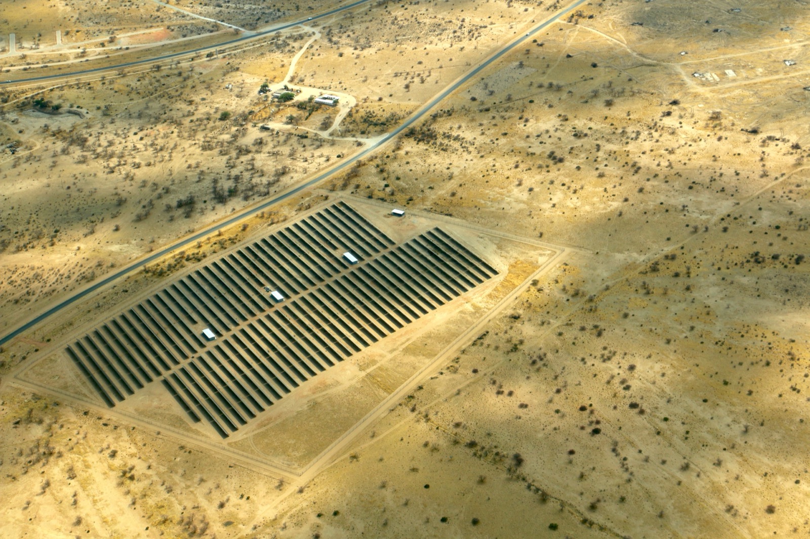 Aerial view of a utility-scale solar power plant in the African savannah